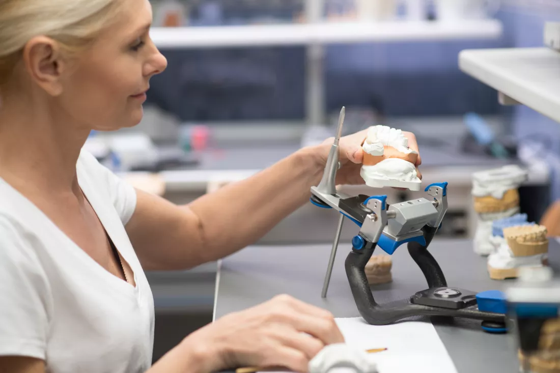prosthetist-female-prosthetist-working-with-plaster-prosthesis