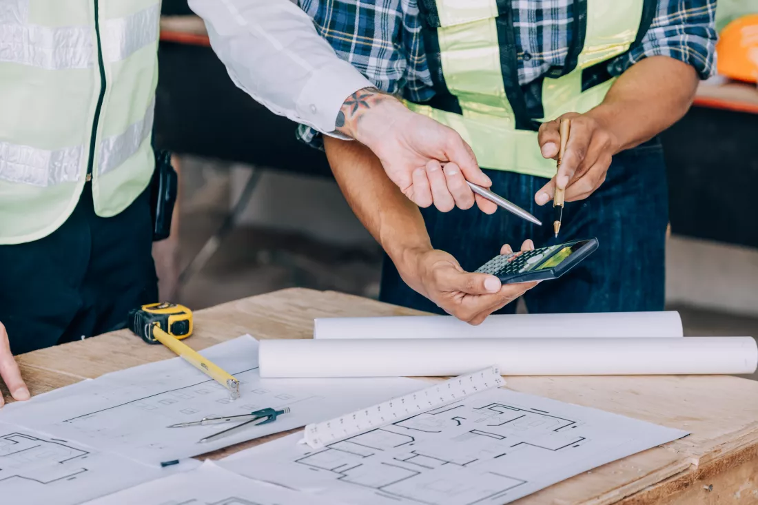 diverse-team-specialists-use-tablet-computer-construction-site-real-estate-building-project-with-civil-engineer-architect-business-investor-general-worker-discussing-plan-details (1)