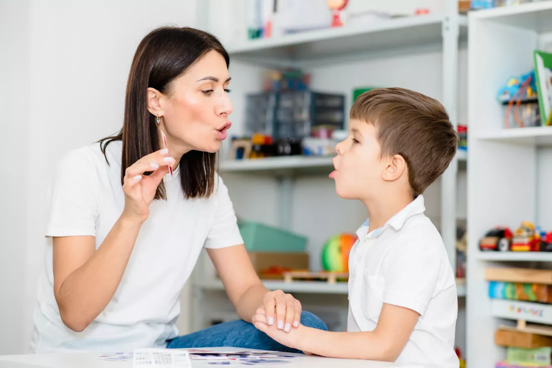 cute-boy-with-speech-therapist-is-taught-pronounce-letters-words-sounds